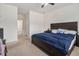 Spacious bedroom with carpeted floors, ceiling fan, and natural light at 2304 Pelham Pass, Dacula, GA 30019