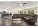 Open-concept living area with kitchen view, stylish floors, and comfortable seating for relaxation and entertainment at 2304 Pelham Pass, Dacula, GA 30019