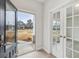 Inviting entryway showcasing French doors and views of the front yard at 3614 Squires Park Ln, Loganville, GA 30052
