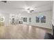 Open-concept living space with kitchen island and ample natural light at 3614 Squires Park Ln, Loganville, GA 30052