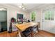 Breakfast area with wood table and chairs adjacent to door to deck at 4323 Japonica Sw Ct, Lilburn, GA 30047