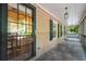 Screened porch showcasing a door, window, and ceiling light fixtures at 4323 Japonica Sw Ct, Lilburn, GA 30047