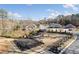 Aerial view of the outdoor pavilion, grass lawn, and fenced in dog park in the community at 5615 Hislop Ln # 82, Mableton, GA 30126
