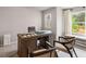 Bright home office featuring a large desk, picture windows, and neutral walls at 5615 Hislop Ln # 82, Mableton, GA 30126