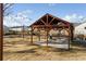 Outdoor pavilion with picnic tables and string lights with a large lawn at 5615 Hislop Ln # 82, Mableton, GA 30126