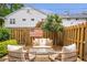 Secluded backyard patio with comfortable seating, enclosed by a wooden fence for privacy and relaxation at 136 Peachtree Memorial Nw Dr # Ri2, Atlanta, GA 30309