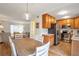 Open concept kitchen and dining area featuring stainless steel appliances and a seamless flow for entertaining at 136 Peachtree Memorial Nw Dr # Ri2, Atlanta, GA 30309