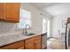 Bright kitchen features granite countertops, stainless steel dishwasher, and a white subway tile backsplash at 136 Peachtree Memorial Nw Dr # Ri2, Atlanta, GA 30309