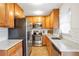 Modern kitchen with stainless steel appliances, granite countertops, and ample cabinet space, blending style and function at 136 Peachtree Memorial Nw Dr # Ri2, Atlanta, GA 30309