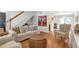 Cozy living room featuring hardwood floors, comfortable sofa seating, and an open layout at 136 Peachtree Memorial Nw Dr # Ri2, Atlanta, GA 30309