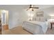 This primary bedroom features neutral walls, a ceiling fan, carpeting, and ensuite at 136 Peachtree Memorial Nw Dr # Ri2, Atlanta, GA 30309