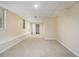 Spacious finished basement featuring an open layout with carpet, ideal for recreation and storage at 300 Twin Tendrils Sw, Atlanta, GA 30331