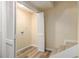 Unfinished basement includes vinyl floors, access to a laundry room and a stairwell at 300 Twin Tendrils Sw, Atlanta, GA 30331