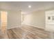 Finished basement includes vinyl floors, access to a bathroom and a stairwell at 300 Twin Tendrils Sw, Atlanta, GA 30331