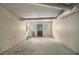 Unfinished basement featuring white walls and a door at 300 Twin Tendrils Sw, Atlanta, GA 30331