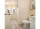 Well-lit bathroom with a classic vanity, tile flooring, and a fresh, clean aesthetic at 300 Twin Tendrils Sw, Atlanta, GA 30331