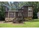 Charming two-story home with a stone foundation and lush greenery at 300 Twin Tendrils Sw, Atlanta, GA 30331