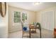 Bright home office with natural light, neutral colors, and ample space for productivity at 300 Twin Tendrils Sw, Atlanta, GA 30331