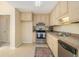 Practical kitchen with stainless steel oven, plentiful storage, and an easy-to-clean tile floor at 300 Twin Tendrils Sw, Atlanta, GA 30331
