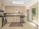 Functional kitchen design with stainless steel appliances, ample cabinet space, and natural light at 300 Twin Tendrils Sw, Atlanta, GA 30331