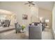 Open-concept living room featuring neutral tones, plush seating, and stylish decor at 300 Twin Tendrils Sw, Atlanta, GA 30331
