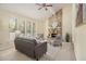 Inviting living room boasts a stone fireplace, high ceilings, and natural light at 300 Twin Tendrils Sw, Atlanta, GA 30331