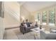 Spacious living room with bright windows, comfortable seating, and modern decor at 300 Twin Tendrils Sw, Atlanta, GA 30331