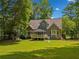 Inviting backyard featuring a well-maintained lawn and deck with gazebo at 507 Wintergreen Way, Canton, GA 30115