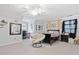 Spacious bedroom featuring plush carpeting, a ceiling fan, and a cozy seating area by the window at 507 Wintergreen Way, Canton, GA 30115