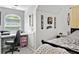 Bedroom with a dedicated workspace, featuring a desk with a view and modern decor at 507 Wintergreen Way, Canton, GA 30115