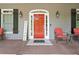 Inviting front porch with seating and a vibrant front door at 507 Wintergreen Way, Canton, GA 30115