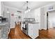 Charming kitchen featuring a center island, white cabinetry, and stainless steel appliances at 507 Wintergreen Way, Canton, GA 30115
