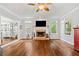 Spacious living room with hardwood floors, fireplace, and natural light at 507 Wintergreen Way, Canton, GA 30115