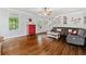 Cozy living room with hardwood floors, comfortable seating, and staircase view at 507 Wintergreen Way, Canton, GA 30115