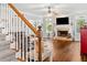 Bright living room with hardwood floors, fireplace, and crown molding at 507 Wintergreen Way, Canton, GA 30115