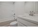 Clean bathroom features a tub, vanity, and single sink with modern fixtures and neutral design at 913 Agate Ln, Lawrenceville, GA 30043