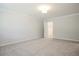 Spacious carpeted bedroom with entrances to closet at 913 Agate Ln, Lawrenceville, GA 30043