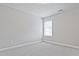 Cozy bedroom with plush carpeting, bright window with blinds, and neutral color palette at 913 Agate Ln, Lawrenceville, GA 30043