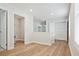 Hallway with wood floors and entrances to closets and bathroom at 913 Agate Ln, Lawrenceville, GA 30043