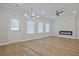 Bright living space with light wood flooring, recessed lighting, and modern fixtures at 913 Agate Ln, Lawrenceville, GA 30043