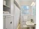 Cozy bathroom showcases custom tiling, pedestal sink, and built-in linen storage at 1046 S Mcdonough St, Decatur, GA 30030