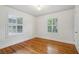 Neutral bedroom with hardwood floors, natural light, and bright white walls at 1046 S Mcdonough St, Decatur, GA 30030