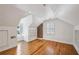 Bright bedroom featuring hardwood floors, built-in shelving, and window seating at 1046 S Mcdonough St, Decatur, GA 30030