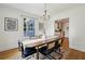 Stylish dining room with hardwood floors, modern decor, and seamless access to the adjacent kitchen at 1046 S Mcdonough St, Decatur, GA 30030