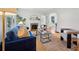 Bright living room with a cozy fireplace, comfortable seating, hardwood floors, and natural light at 1046 S Mcdonough St, Decatur, GA 30030