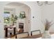 Bright living room showcasing an arched doorway and fireplace with mantle at 1046 S Mcdonough St, Decatur, GA 30030