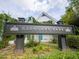 Glenlake Park sign in Decatur with stone columns and greenery backdrop at 1046 S Mcdonough St, Decatur, GA 30030