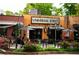 Exterior view of Universal Joint restaurant with outdoor seating, and flower beds at 1046 S Mcdonough St, Decatur, GA 30030
