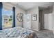 Gray bedroom with neutral tones and a basketball theme is illuminated by a large window at 2 Silver Leaf Trl, Douglasville, GA 30134