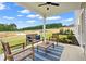 Covered patio with outdoor seating and views of the backyard is perfect for enjoying the outdoors at 2 Silver Leaf Trl, Douglasville, GA 30134